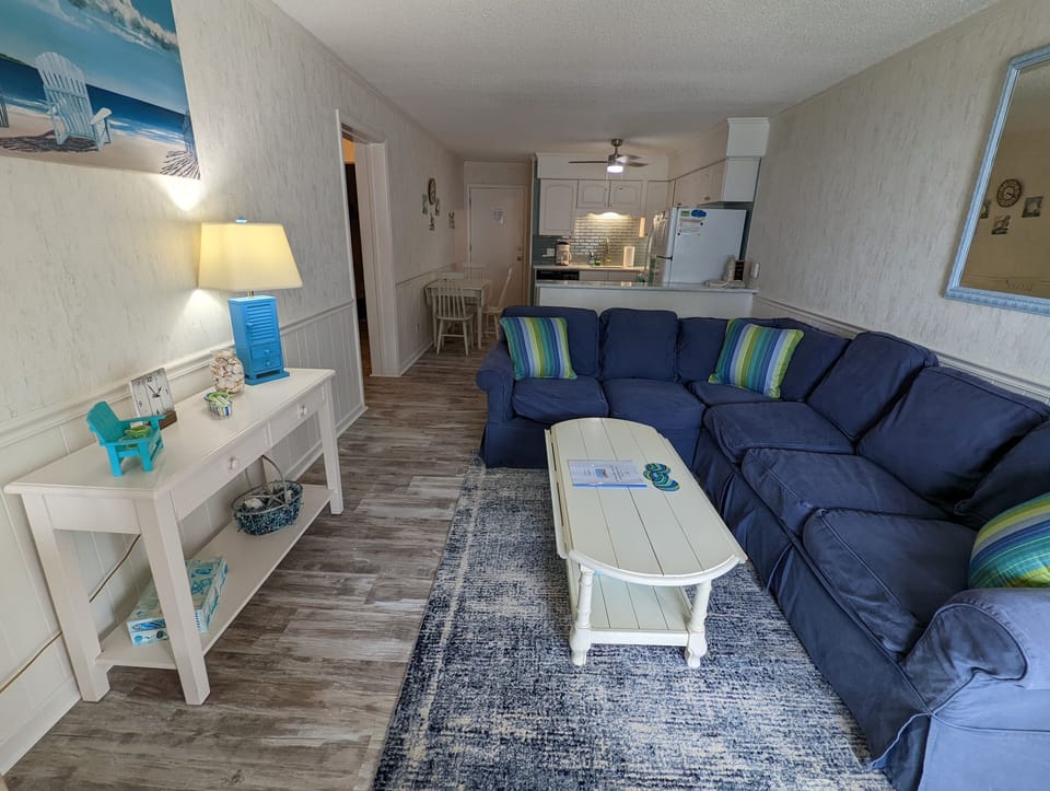 A beautiful living area decorated tastefully with lots of seating