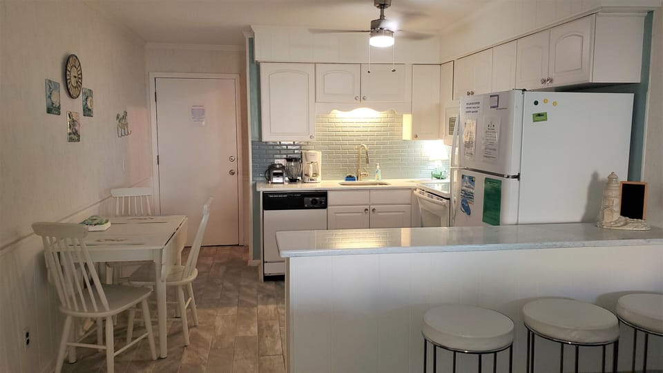 Kitchen Updated- all new flooring,  appliances, quartzite counter and backsplash