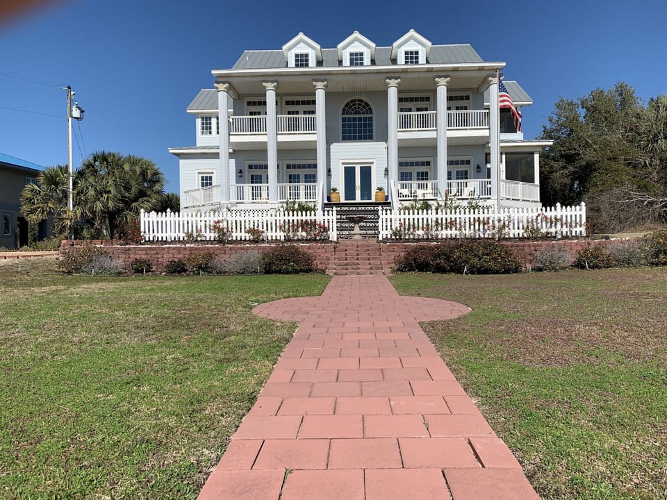 Home is 5,000 sq ft, 2,000 sq ft porch.  Property is 2 acres.  