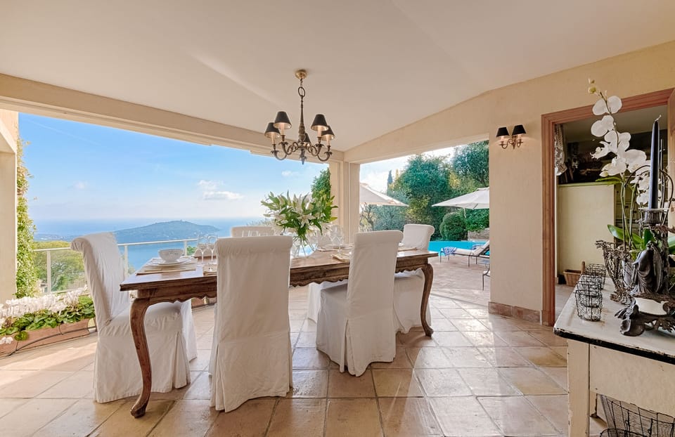 Dining table seats 8, and has spectacular views for summer lunches & fireworks.