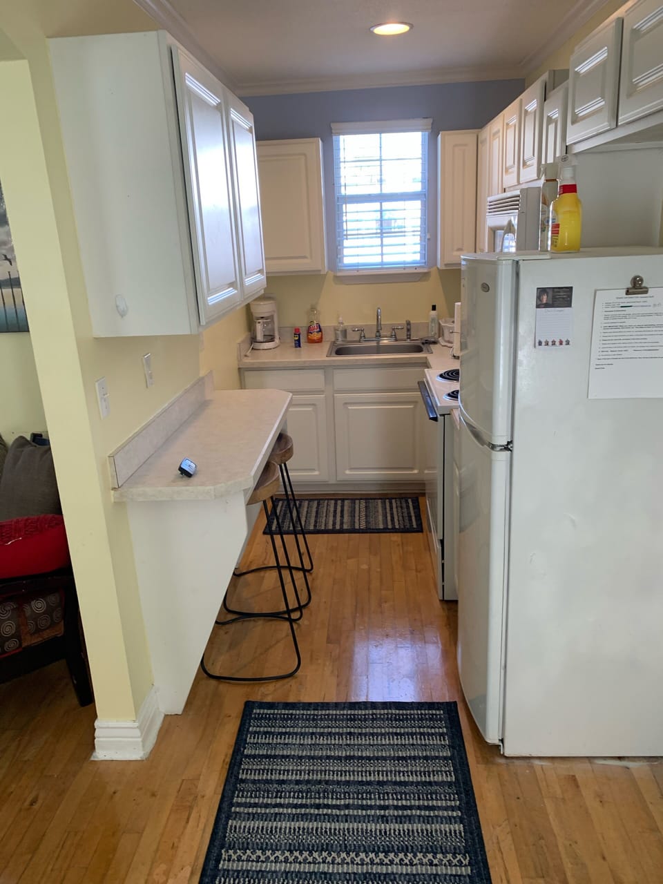 Fully stocked kitchen with appliances.
