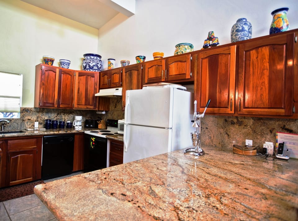 our fully equipped kitchen with Brazilian granite countertops