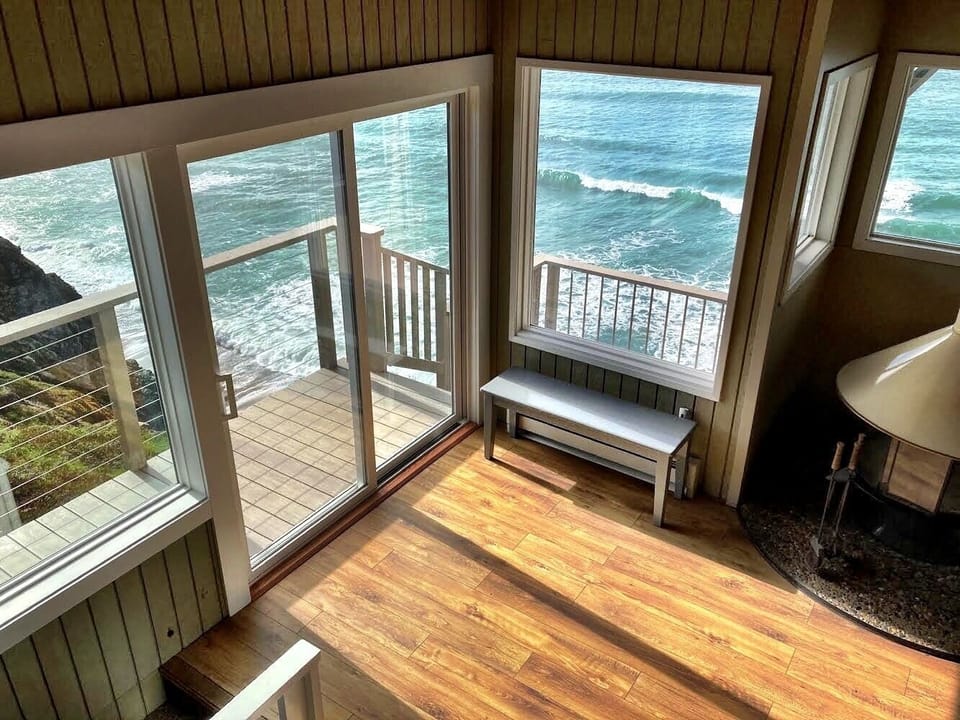 New doors and deck overlooking beach.