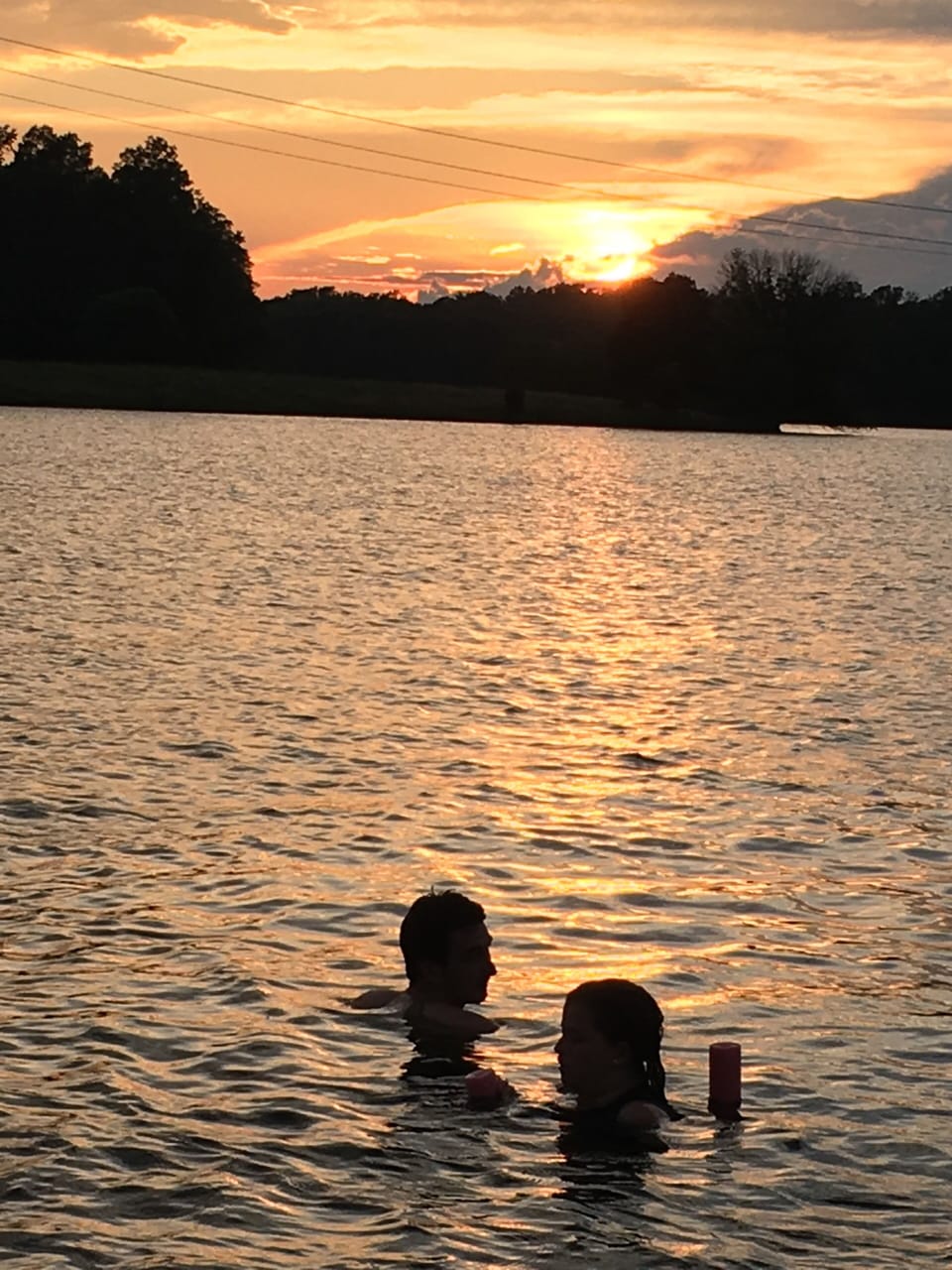 In the water at sunset