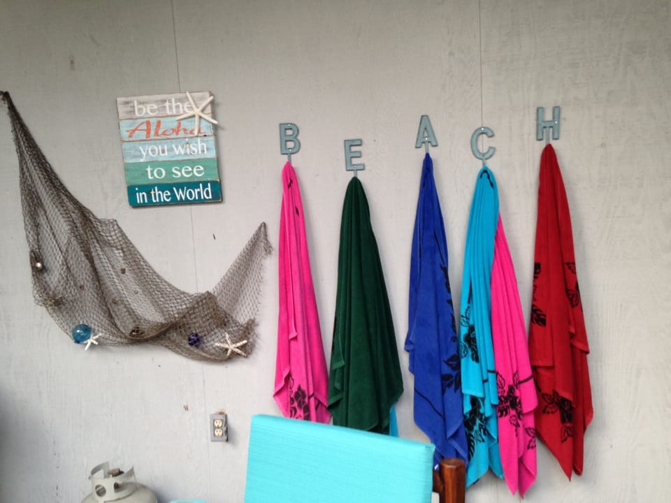 Beach towels, coolers, an assortment of beach toys