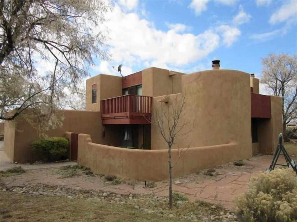 Exterior showing master balcony and patio