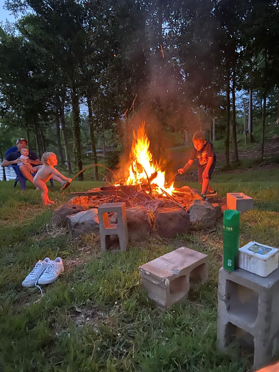 Having fun around the camp fire, even in the summer.