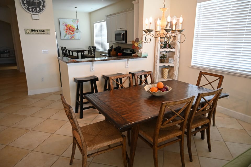 Dining table for 6, 3 bar stools at the kitchen and a 4 top breakfast table.