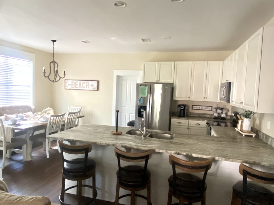 4 Barstools in Kitchen Area. Dining Table Seats 6.