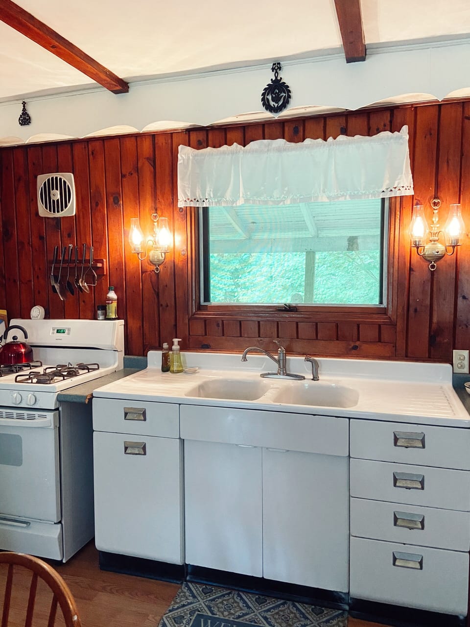 Kitchen double sinks, gas stove, large fridge, large farmhouse kitchen.