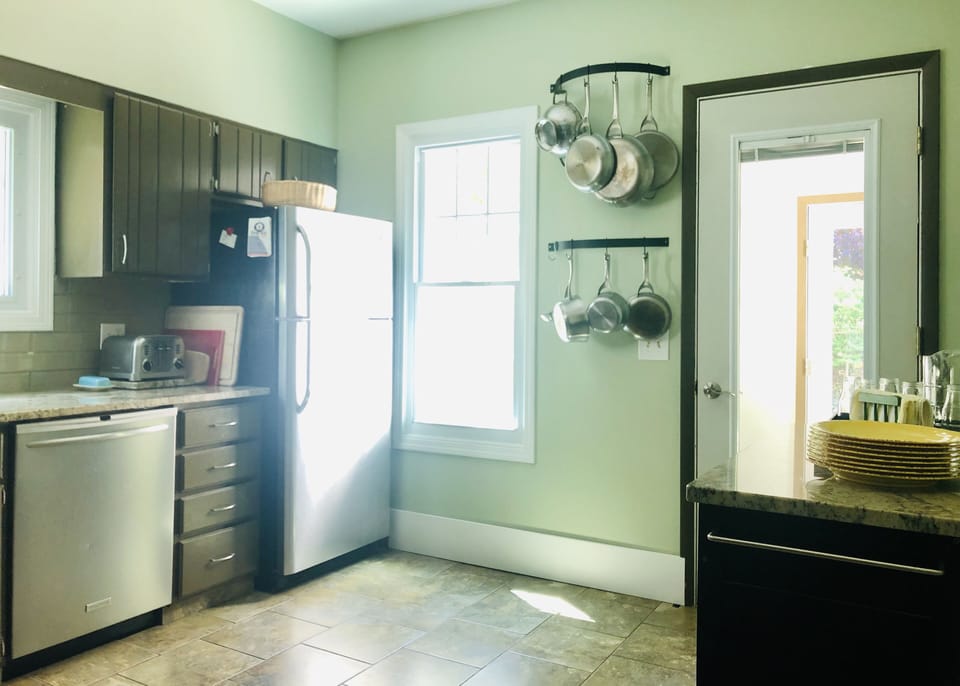 Easy patio access through kitchen. Sunny melamine dishes for out-door dining. 