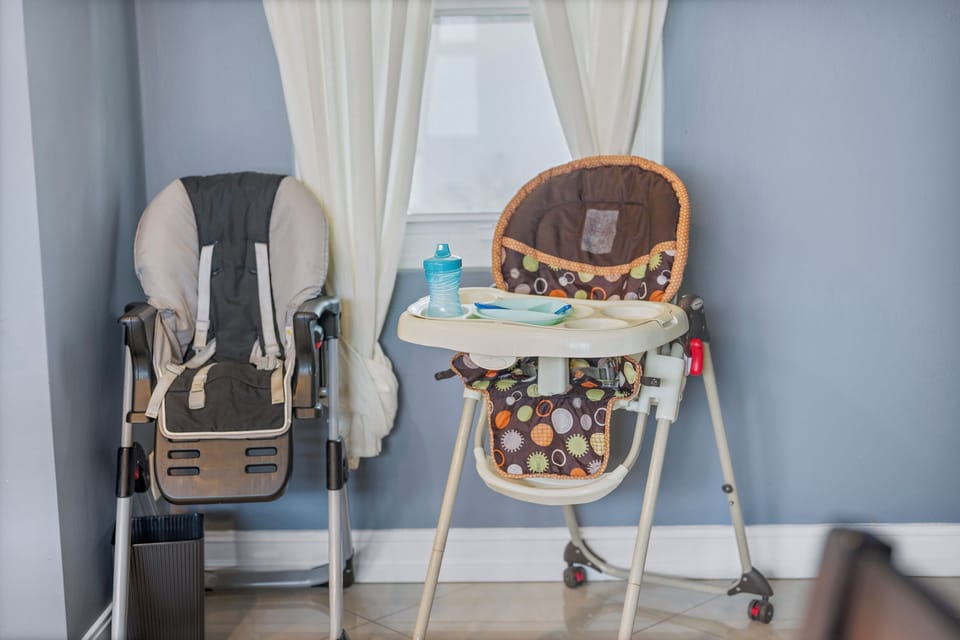 Don't leave anyone out of family dinner--2 high chairs and children's dish ware