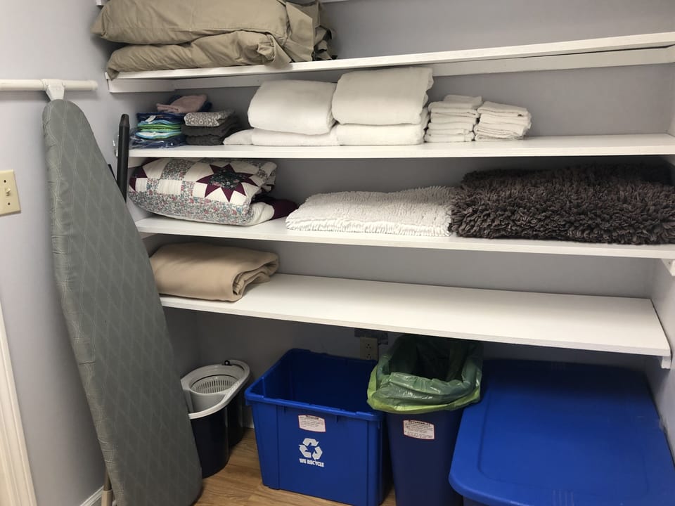 Recycling and backup linens in laundry room