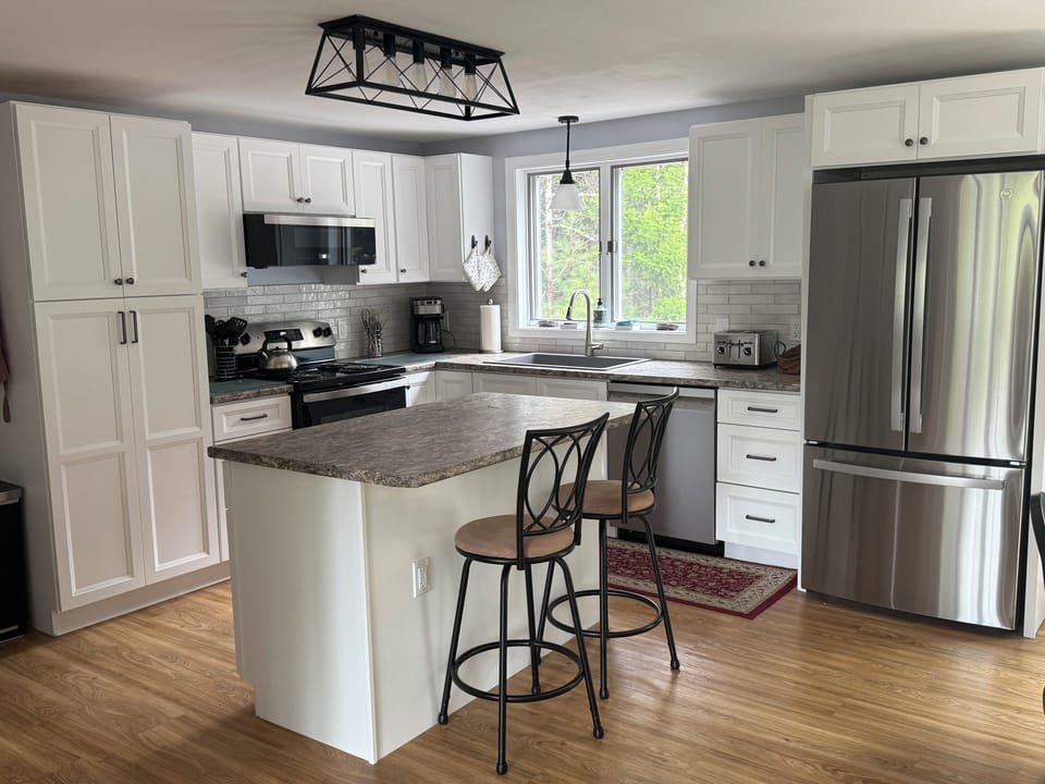 2025 Updated kitchen - cabinets, countertops, appliances, lighting and tile.