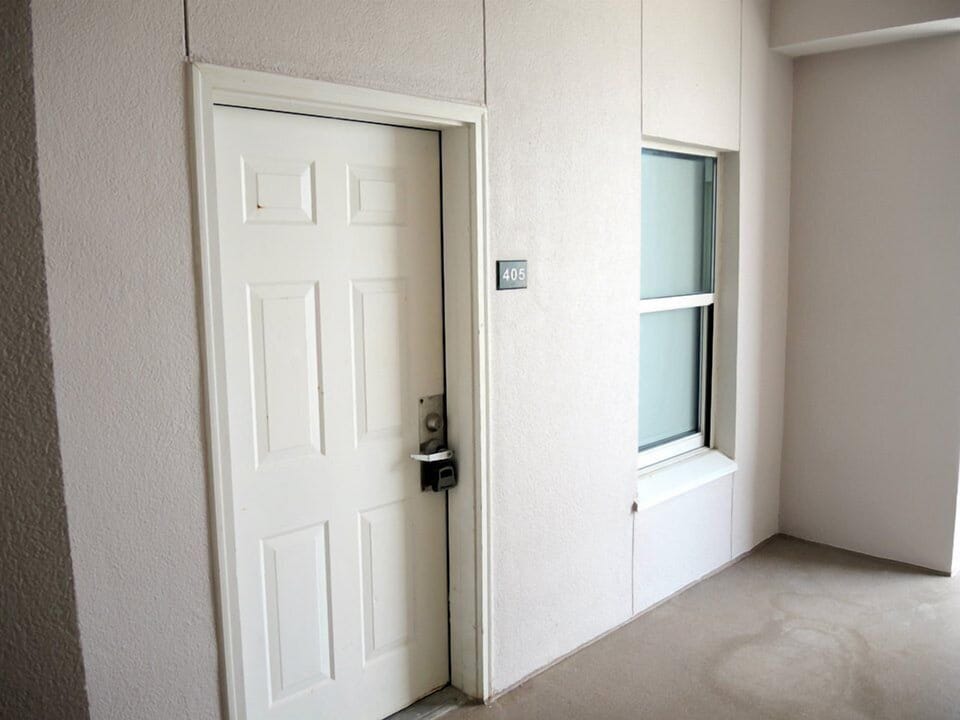 Door to the condo with lockbox for obtaining keys