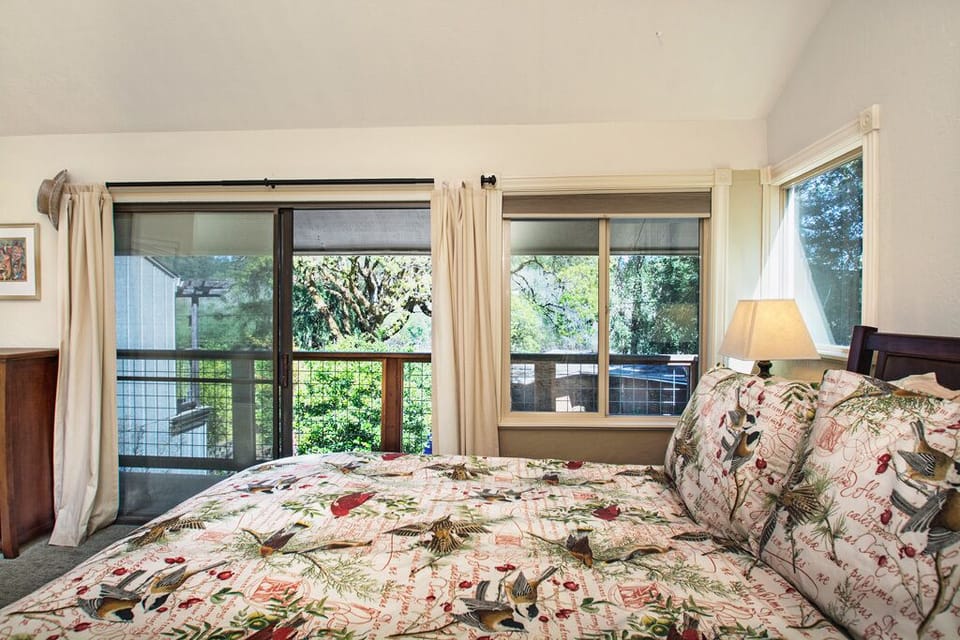 Upstairs Master Bedroom, with Balcony overlooking Front Yard.