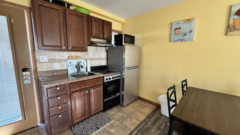 Kitchenette - oven, refrigerator, microwave, coffeemaker, plates, utensils etc.