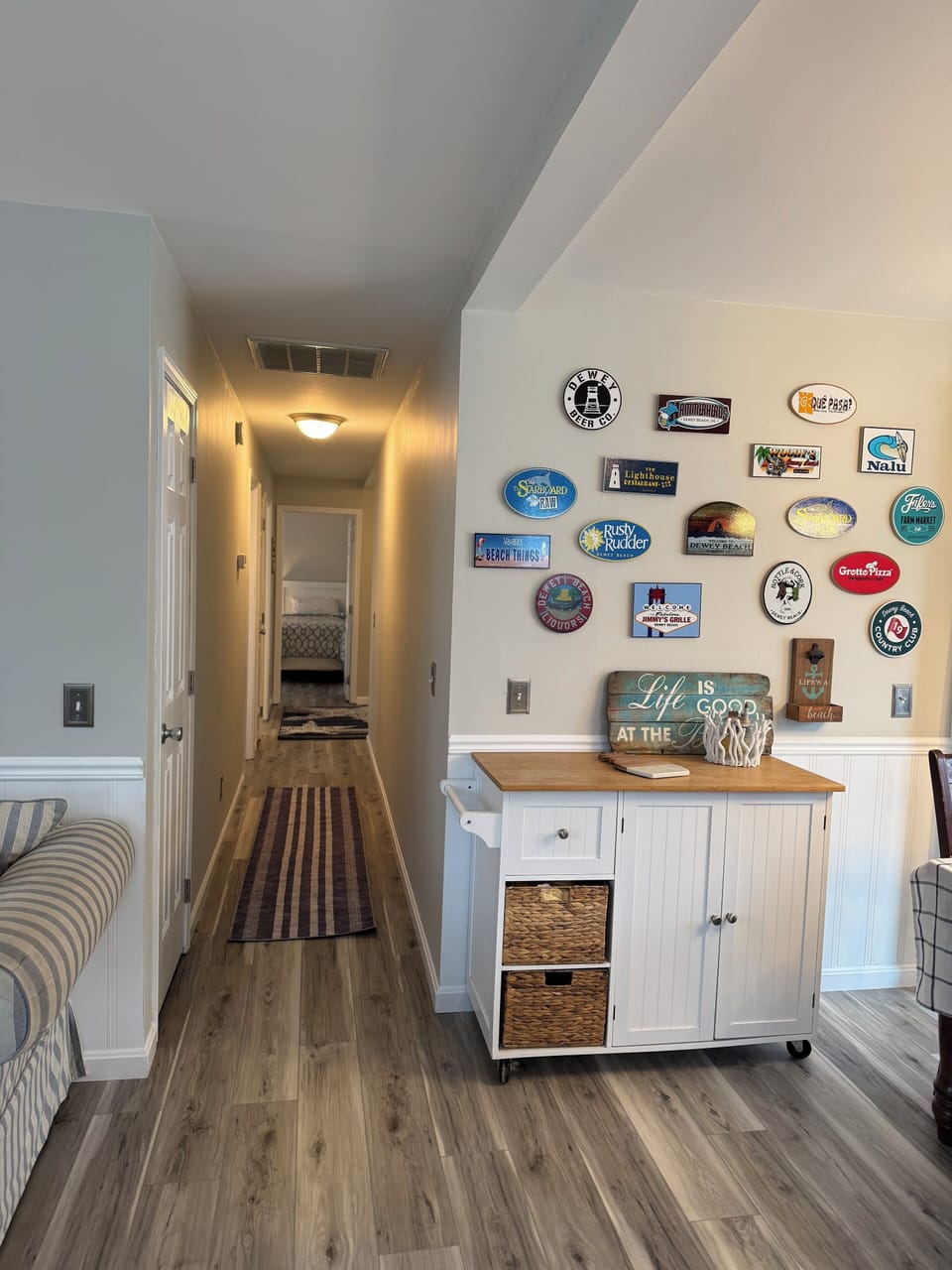 Hallway to 4 bedrooms and 2 full bathrooms