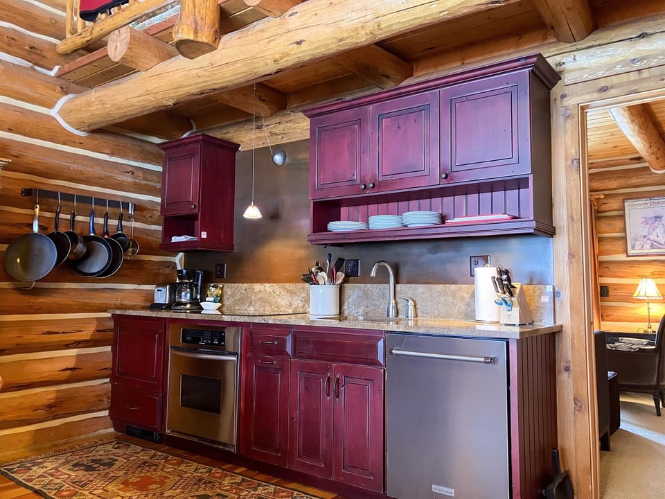 Updated kitchen with stainless steel appliances, granite countertops.