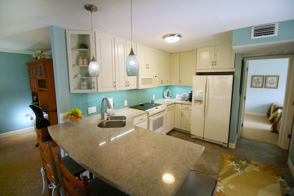 The kitchen is bright although it is in the middle of the condo.