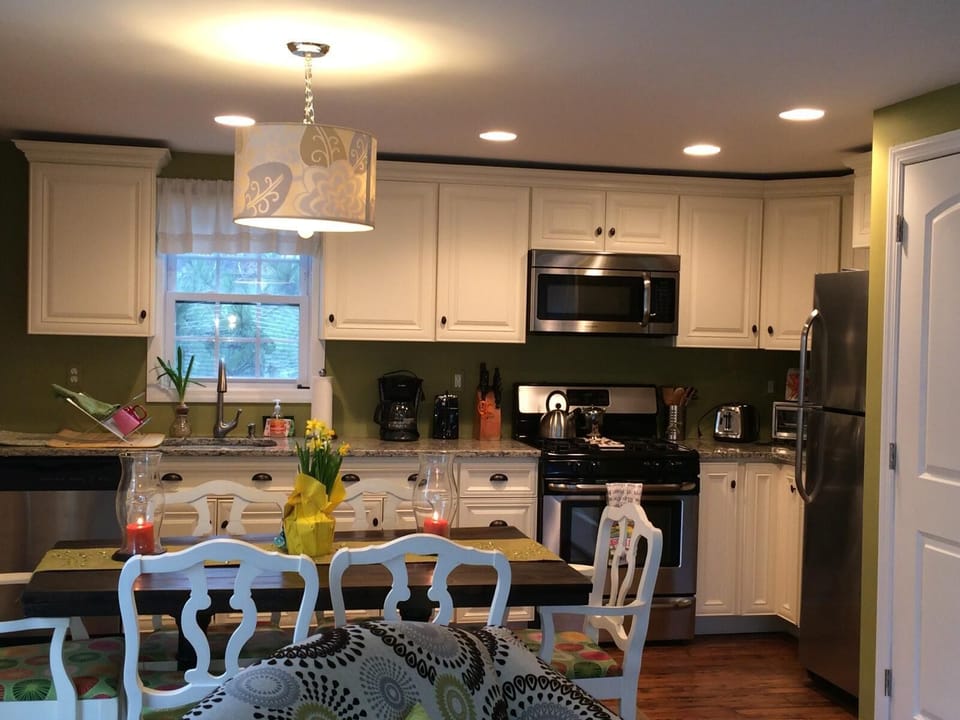 Kitchen also has the washer/dryer unit and seating for six