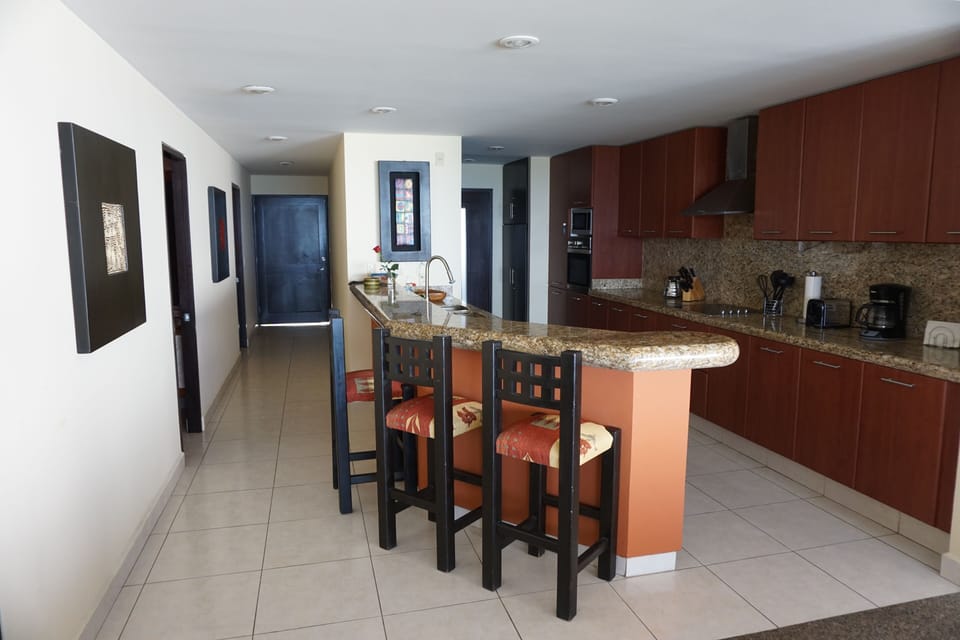 Fully stocked kitchen with granite counters