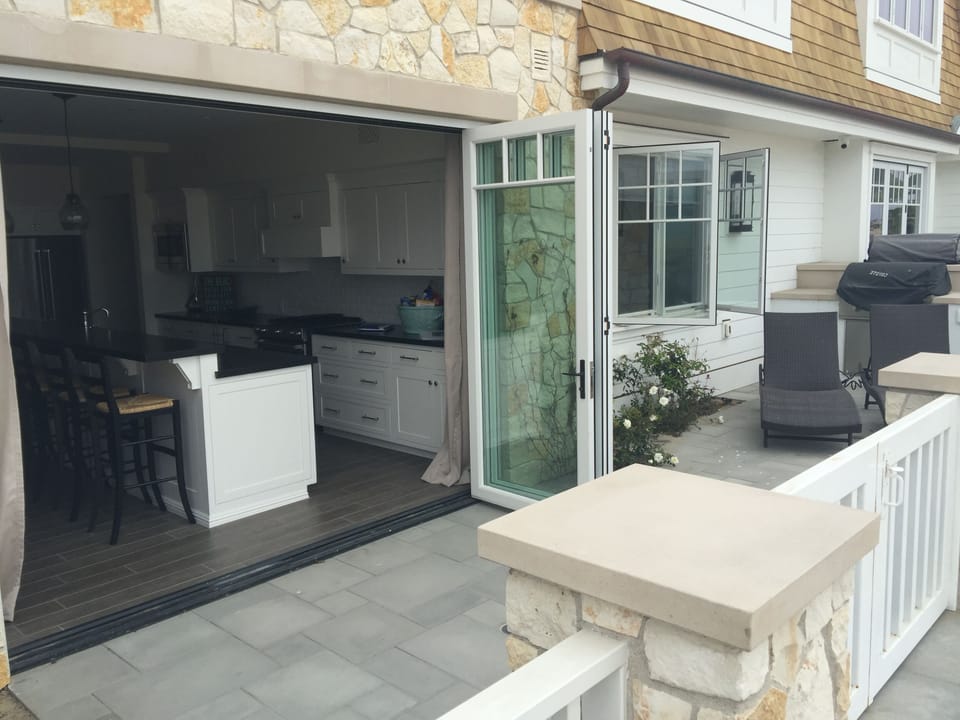 bi-fold doors open from patio to kitchen