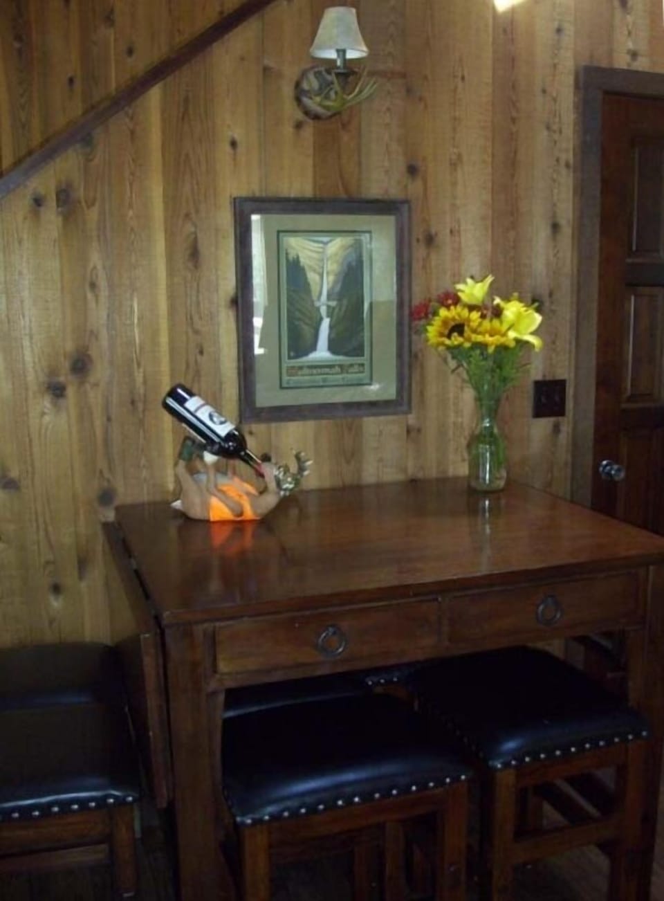 Extendable pub table in great room for family dining.