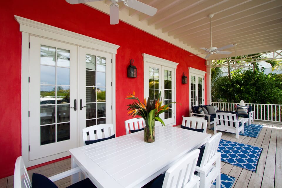 Back patio with table for outdoor dining and cozy sitting area