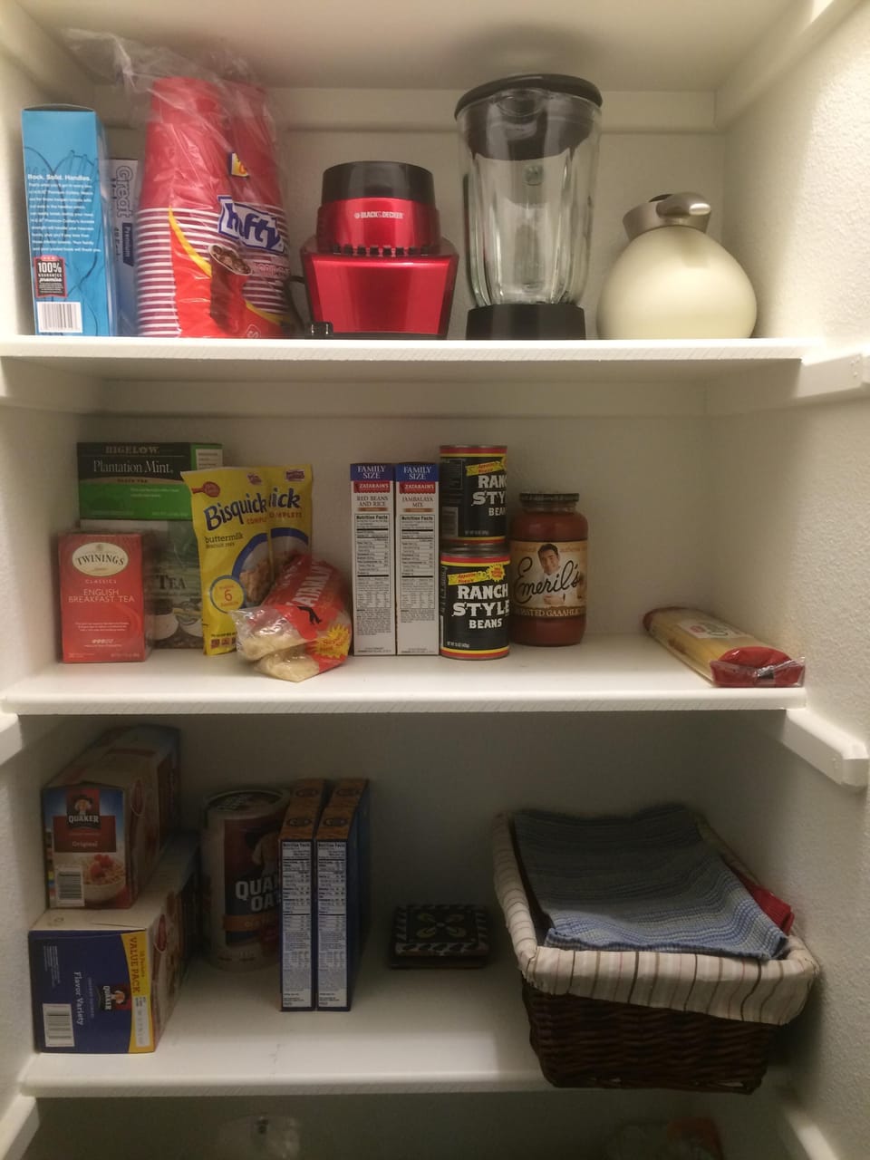Pantry stocked with some breakfast items and other basics