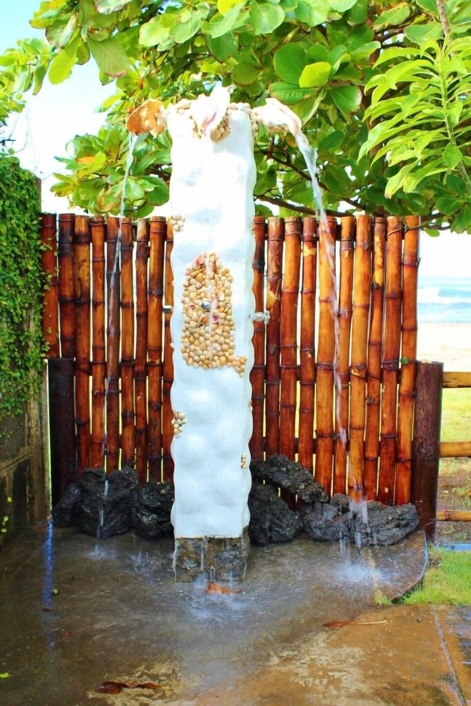 Outdoor shower after a dip in the pool or a surf.