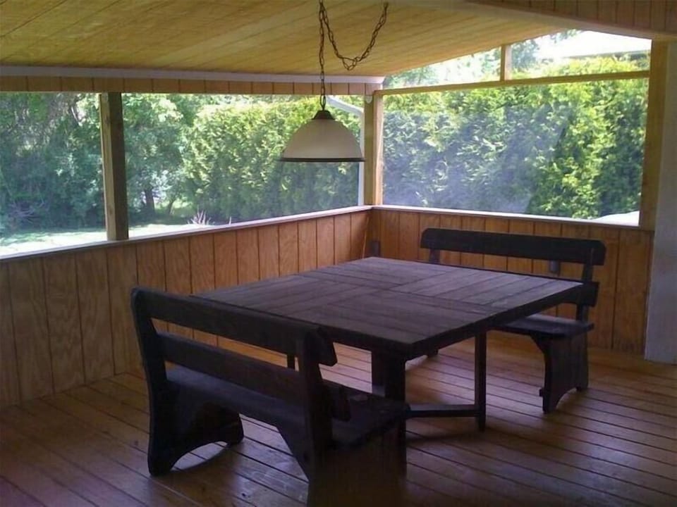 Screened in porch perfect for dining and relaxing