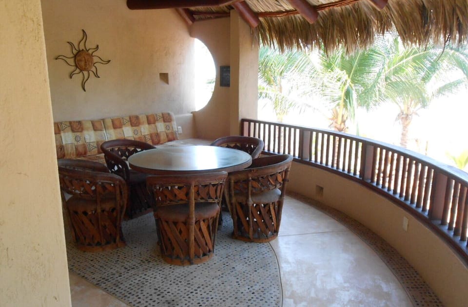 Upstairs, covered sitting area, overlooking pool.  Master suite attached.