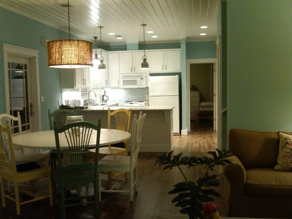 View looking back from living toward dining and kitchen.