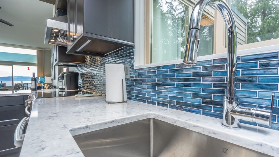 Top quality kitchen with large sink and quartz counters, under cabinet lighting