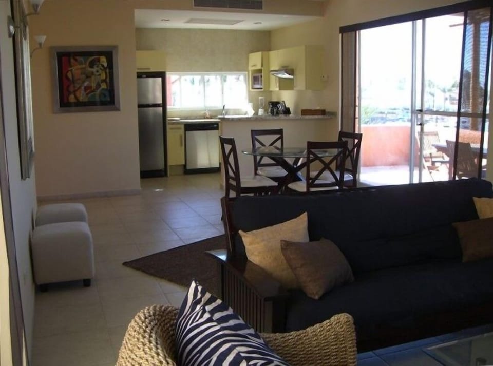 Open living area with great views of the marina, beach and hillside terrain