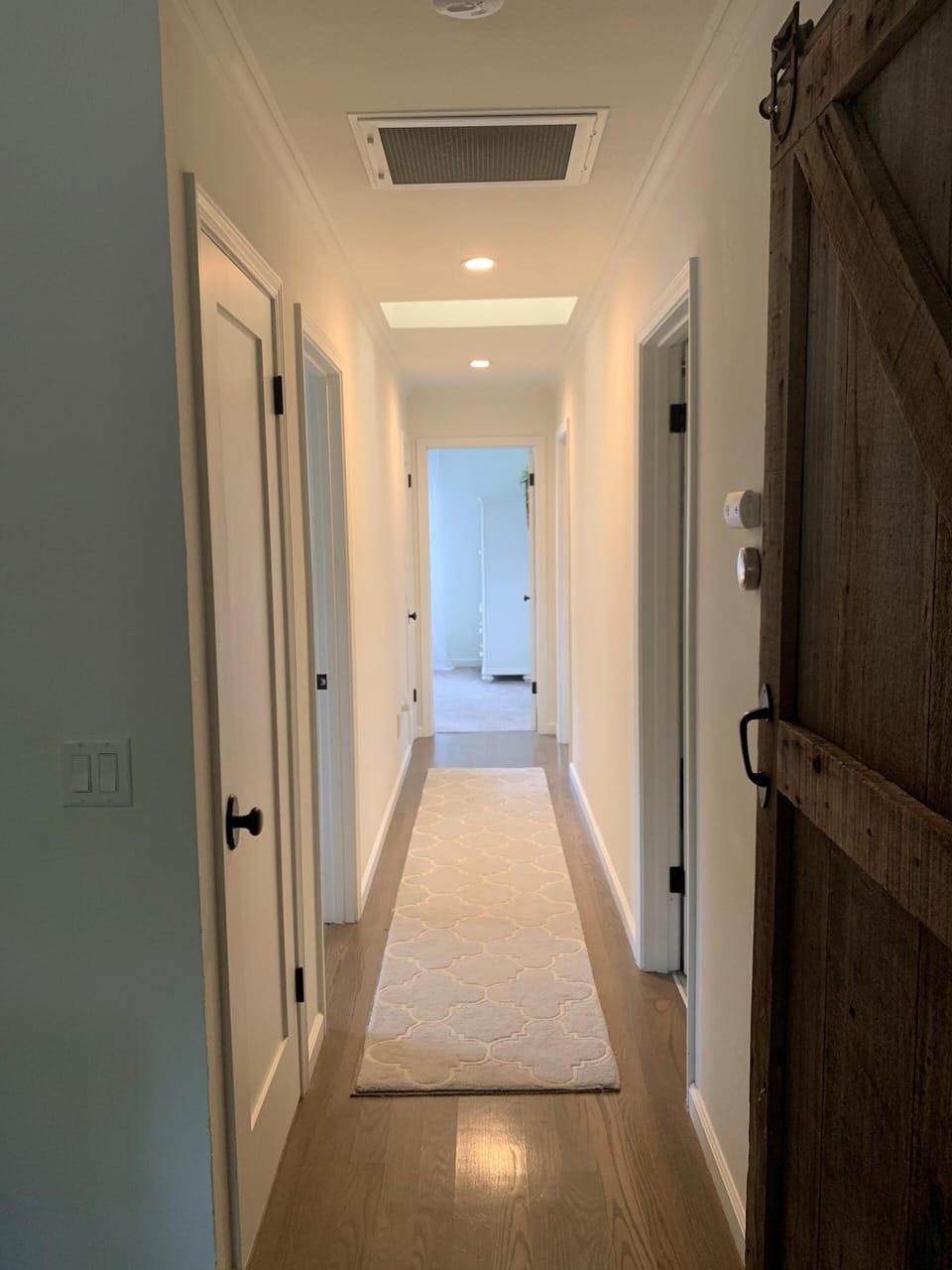 Hallway to 3 bedrooms & 2 bathrooms