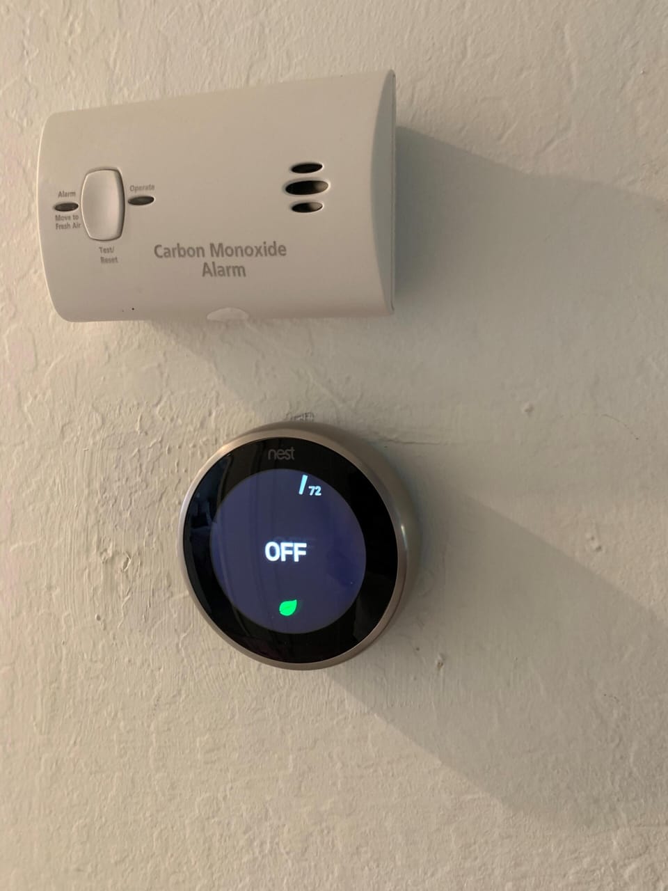 Nest thermostat for AC & Heat control + Carbon Monoxide alarm above it