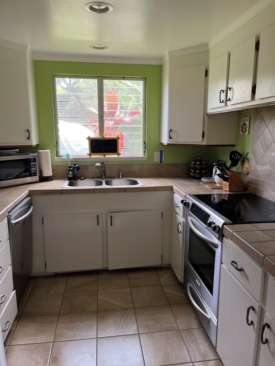 Fully equipped kitchen with stainless steel appliances.