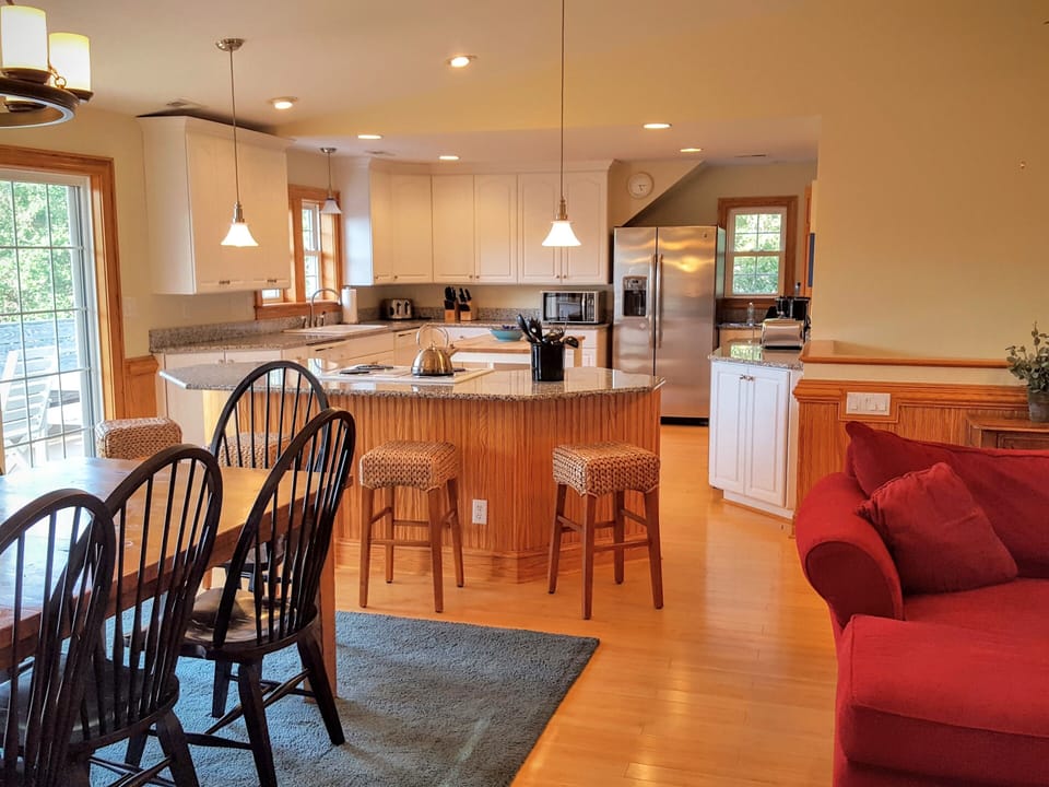 Large open kitchen. Island has stools that seats 4.