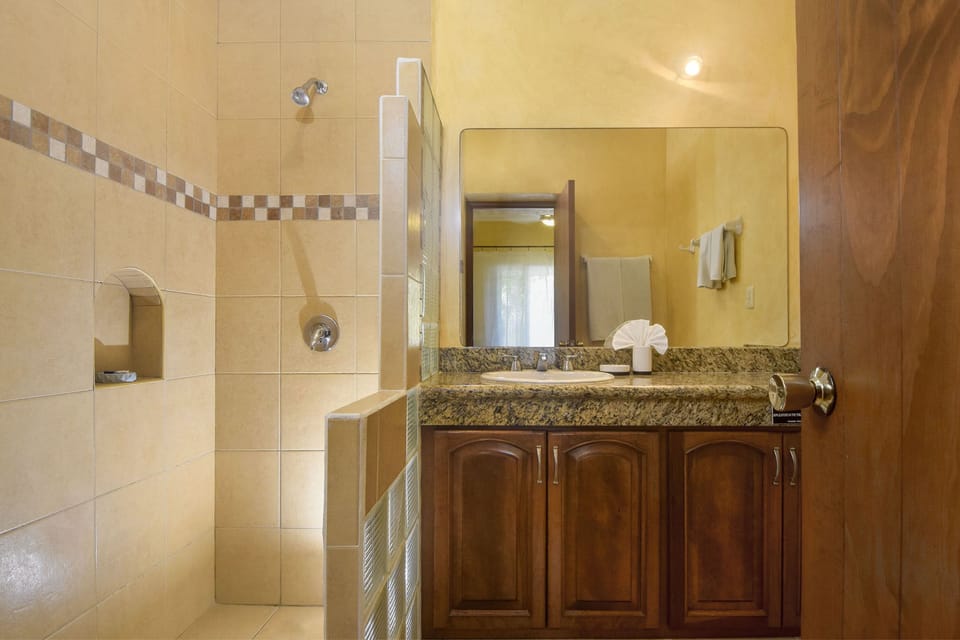 bathrooms are tile, granite and glass block 