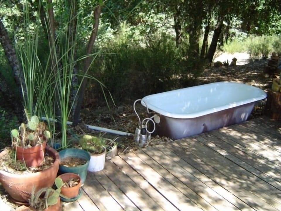 Outdoor claw foot bathtub... (Pure heaven, and yes--the water is hot.)