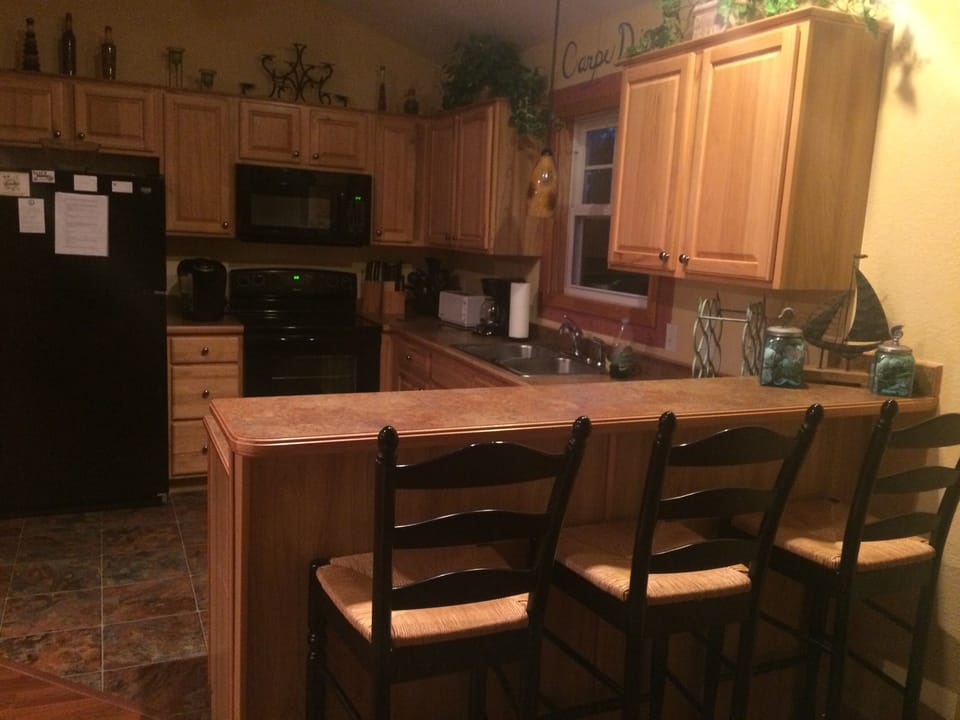 Kitchen. 3 bar stools for additional seating. 