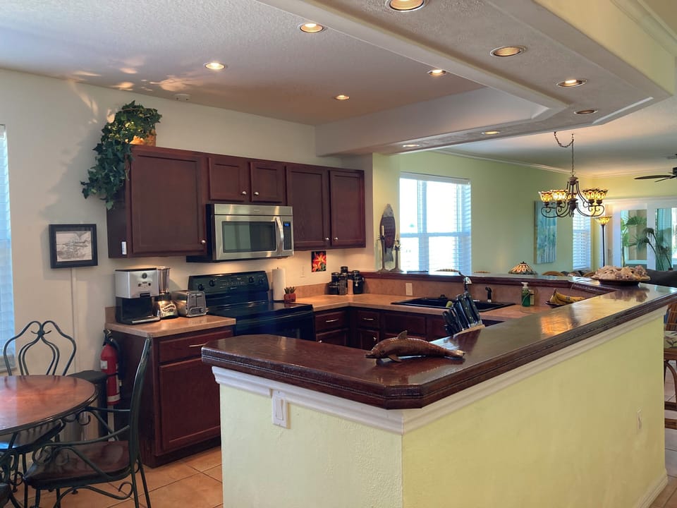 Beautiful open kitchen with custom oak bar top