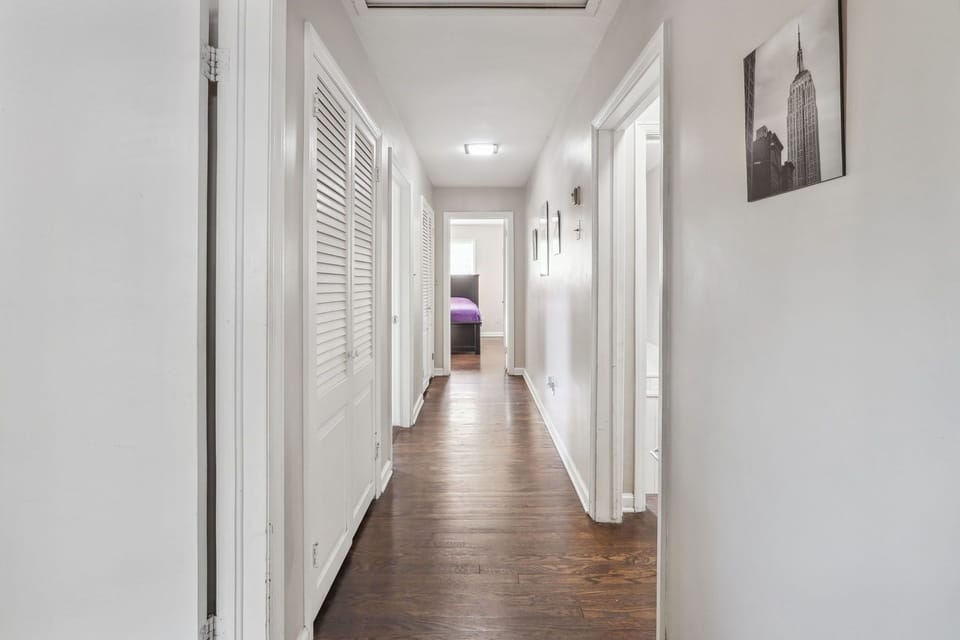 Main Level Hallway to Bedrooms/Bathroom with Guest closets