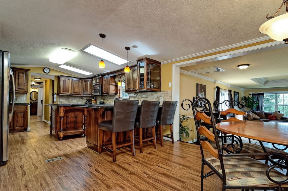 Kitchen, Dining and additional seating at bar area