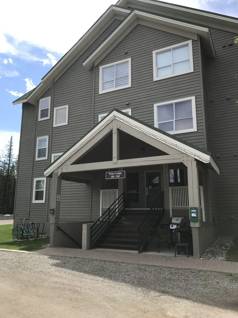 Front of Pine Building with 2 barbeques
