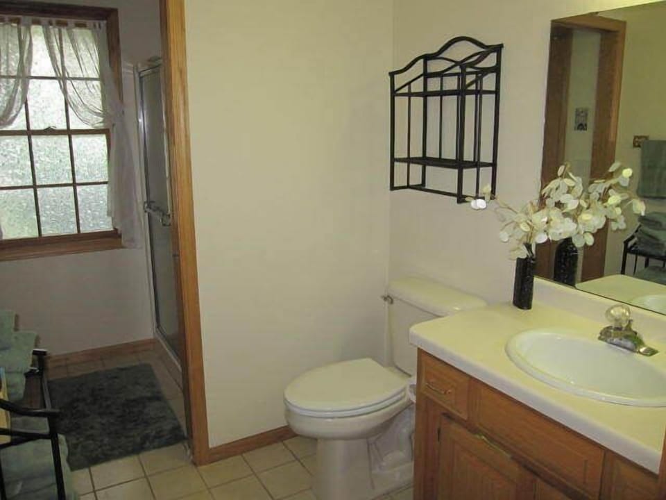 Guest bathroom with pocket door to shower room