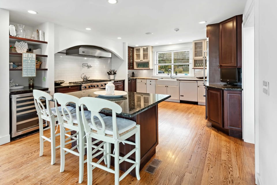 Large open kitchen with top Viking  appliances and Wine cooler.