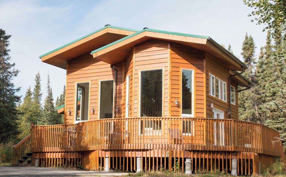 Secluded Alaskan home with wrap around deck and full mountain views.